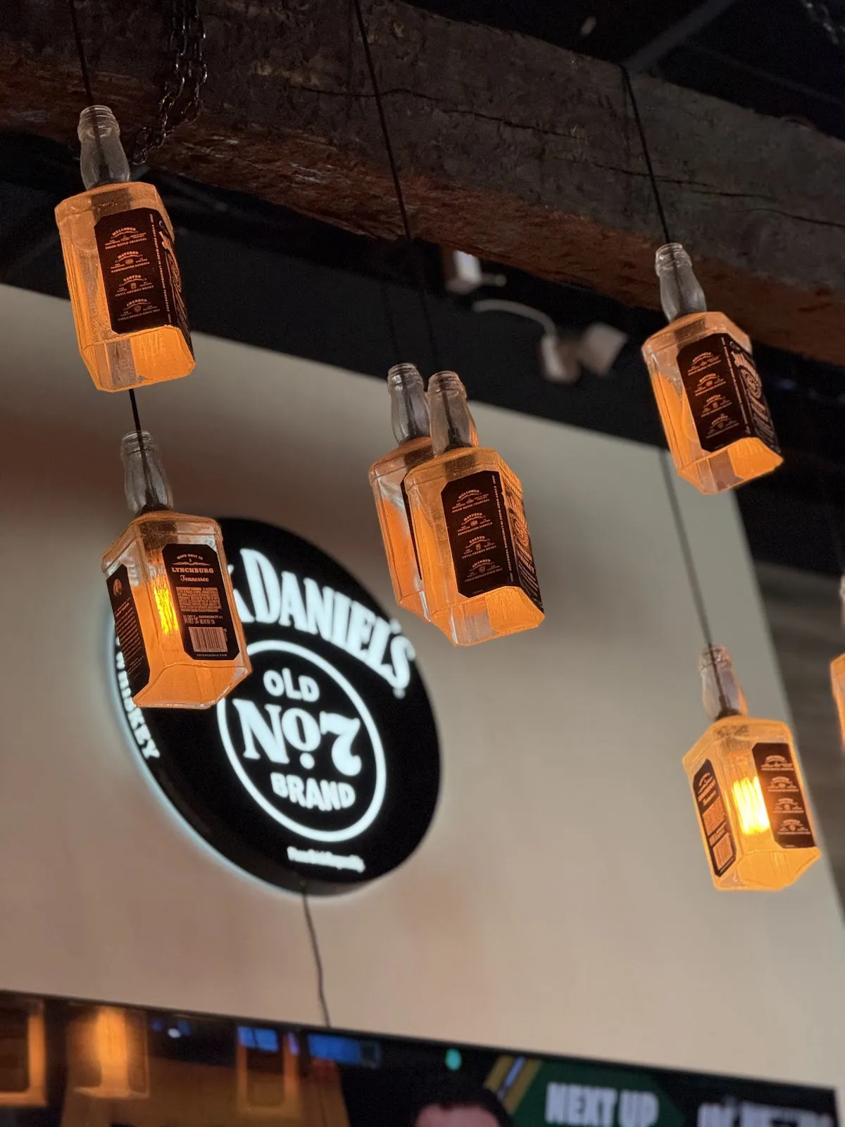 Bottle pendant lights over the bar