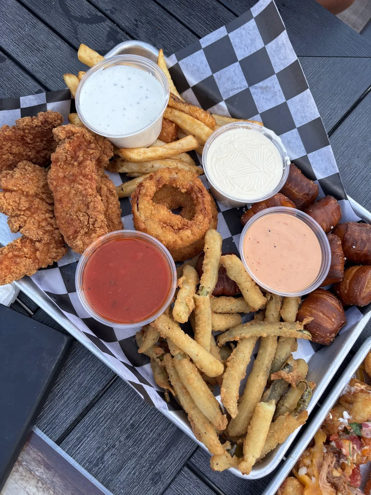 Shareable platter with tenders, rings and dips